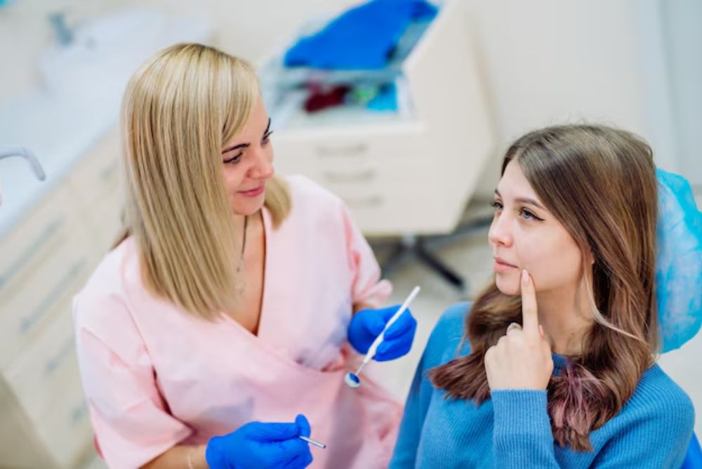 female patient discussing dentures with a dentist